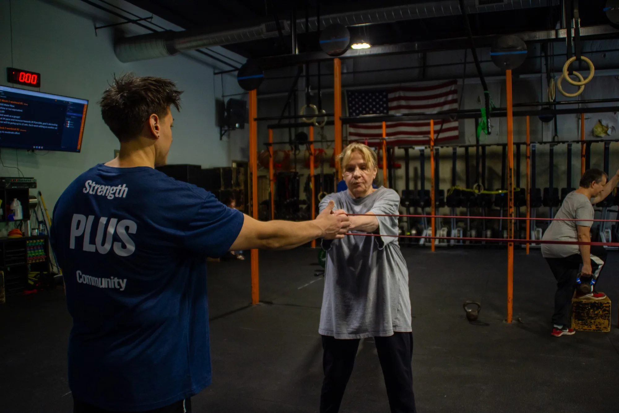 Doctor of Physical Therapy Jen Ciardulli gives hands-on coaching to a client at Top Form Physical Therapy, Branford CT